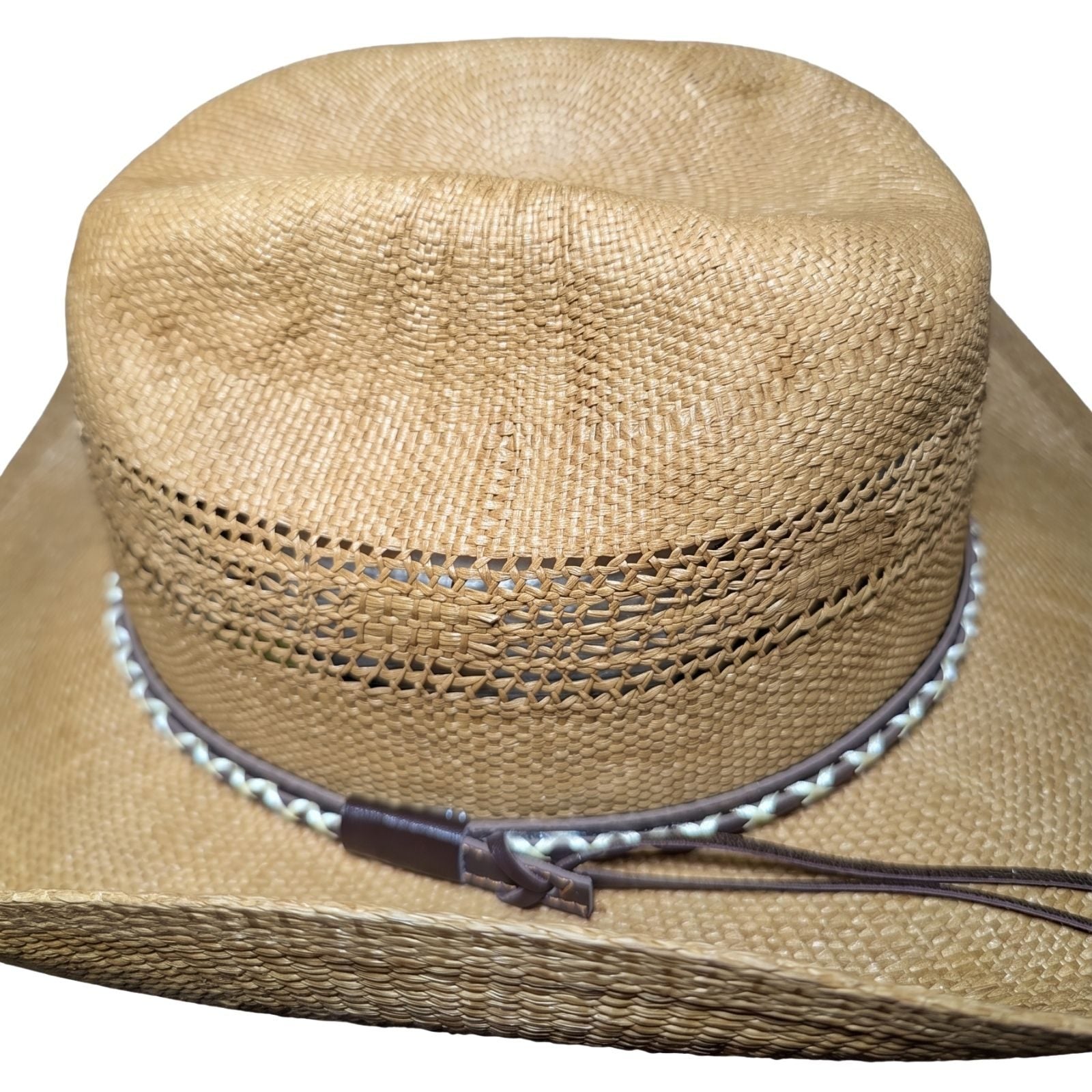 Tan Criss-Cross Band Cowboy Hat by Redneck Legends — top view of the caramel-tan cattleman crease crown with brown leather keeper and twin band tails