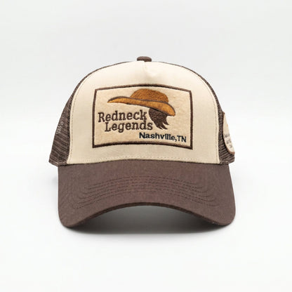 Redneck Legends Cream &amp; Brown Trucker Hat — front view, cream crown with embroidered cowboy hat and mullet logo patch, brown brim