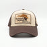 Redneck Legends Cream & Brown Trucker Hat — front view, cream crown with embroidered cowboy hat and mullet logo patch, brown brim