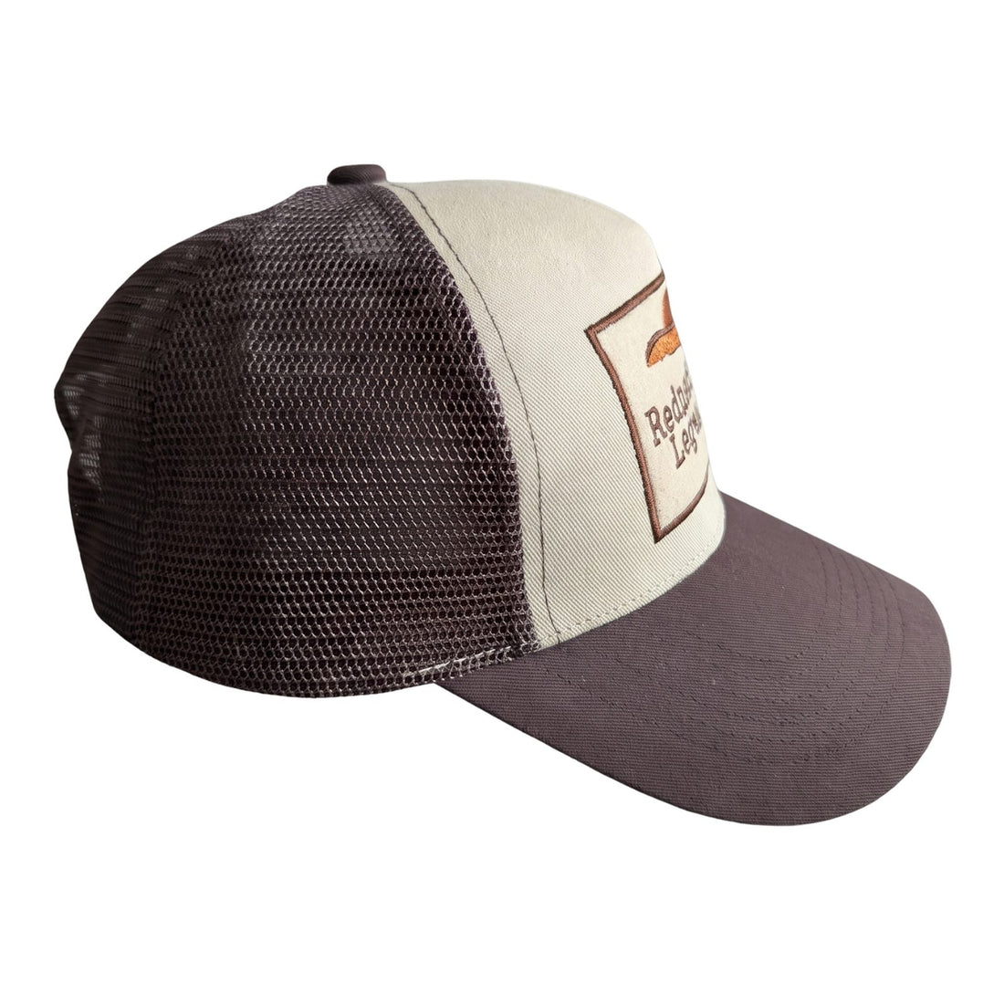 Redneck Legends Cream &amp; Brown Trucker Hat — side profile, cream front panel, brown mesh back and curved brown brim