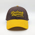 Brown & Gold Snapback Cap by Redneck Legends — brown crown with raised gold "Redneck Legends Nashville TN" embroidery and a golden-yellow curved bill.