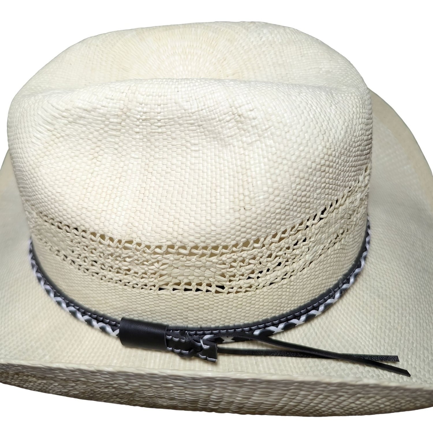 White Criss-Cross Band Cowboy Hat by Redneck Legends — top view of the cattleman crease crown with black braided leather keeper and twin band tails